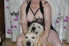Two playful dogs are having nasty fun with a busty zoofil - picture 1