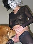 Masked bitch in black stockings gets her pussy licked by dog - picture 5