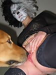 Masked bitch in black stockings gets her pussy licked by dog - picture 6