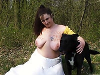 Zoo slut with saggy tits fucks outdoor with a black dog - picture 17
