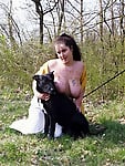 Zoo slut with saggy tits fucks outdoor with a black dog - picture 18