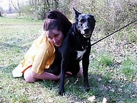 Zoo slut with saggy tits fucks outdoor with a black dog - picture 22