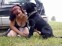 Zoo slut with saggy tits fucks outdoor with a black dog - picture 29