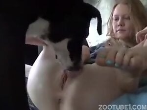 Husband films his wife with dog