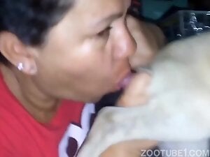 Brunette mom sucking off a dog's dick with passion