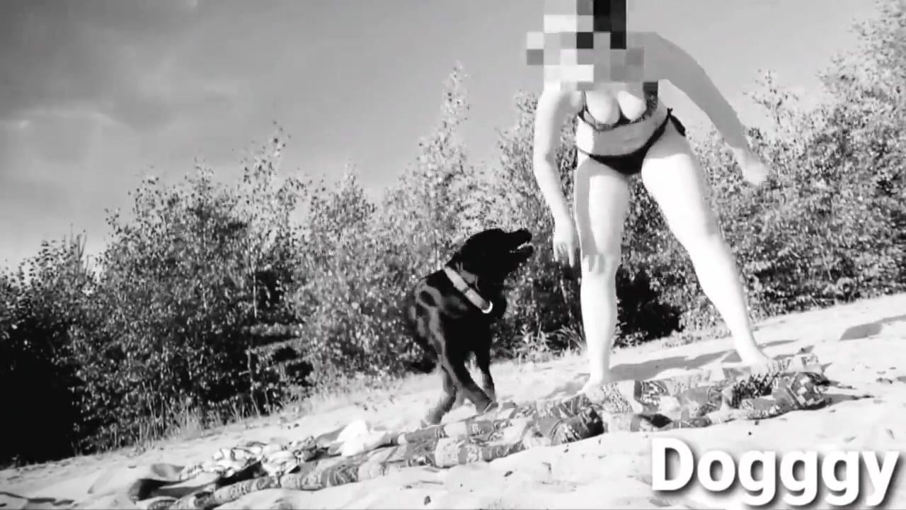 Bikini wearing babe fucks a dog on the beach in B&W