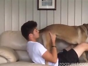 Dude with dark hair decides to deepthroat a dog's cock
