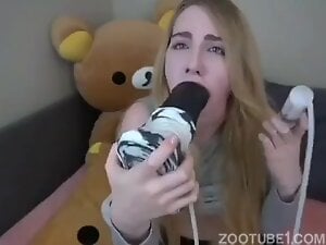 Blonde solo girl fucking her mouth with a horse dildo